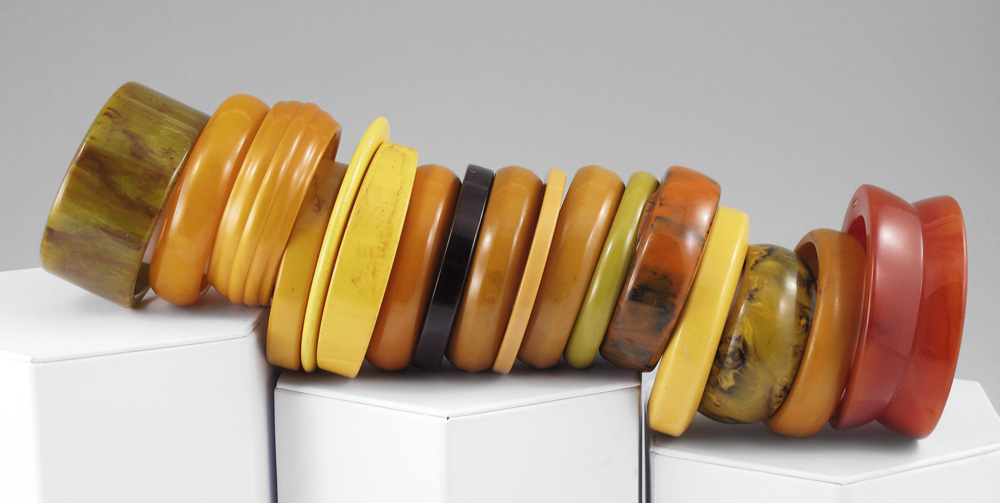 Appraisal: BAKELITE AND PLASTIC BANGLE BRACELETS The swirl bracelet is hinged