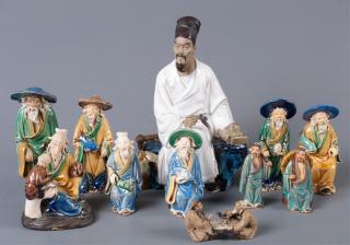 Appraisal: Chinese Mud Figures Eleven Eleven Chinese glazed mud figures of