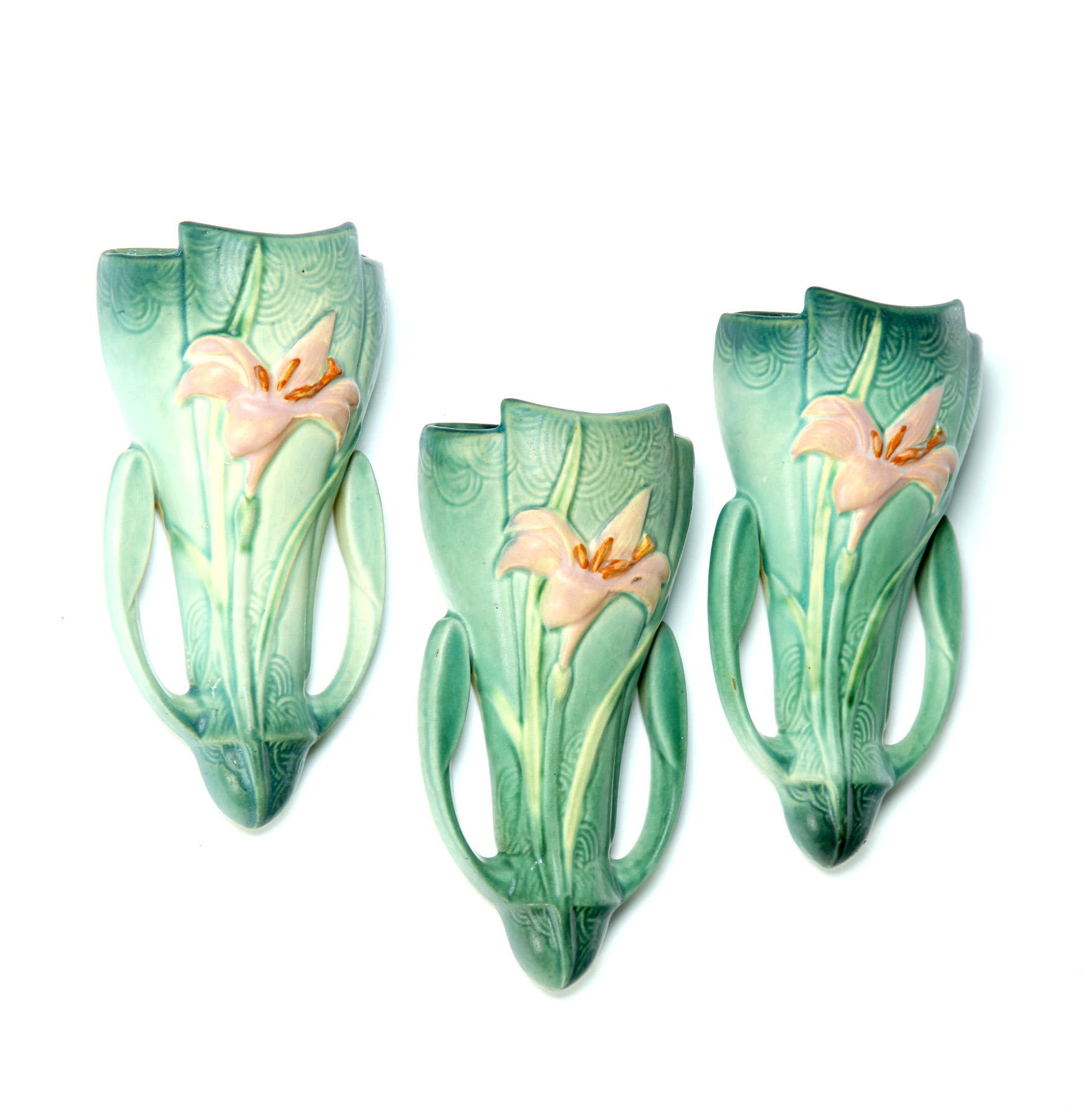 Appraisal: THREE ROSEVILLE ZEPHYR LILY PATTERN WALL POCKETS Ohio nd quarter-