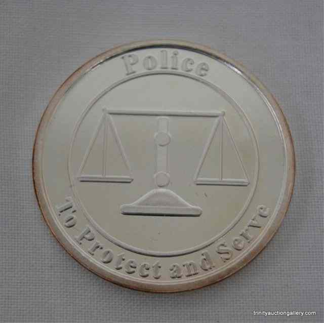 Appraisal: Police - Scale Silver oz Bullion CoinThis is a Fine