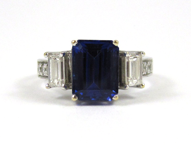 Appraisal: TANZANITE AND EIGHTEEN KARAT WHITE GOLD RING with three round-cut