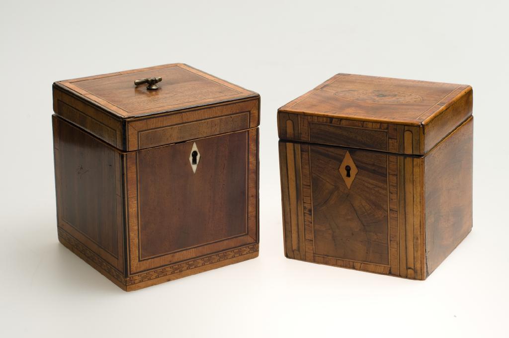 Appraisal: GEORGE III SATINWOOD-CROSSBANDED MAHOGANY TEA CADDY almost cube-form the base