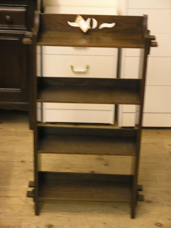 Appraisal: A dark oak open bookcase of four shelves ft in