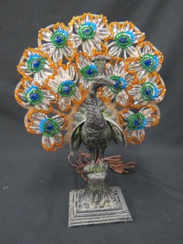 Appraisal: Figural Peacock Lamp metal body with elaborate beadwork shade tall