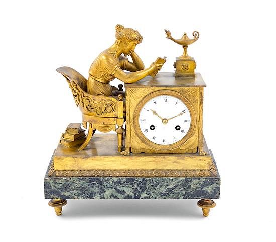 Appraisal: An Empire Gilt Bronze and Marble Mantel Clock Height x