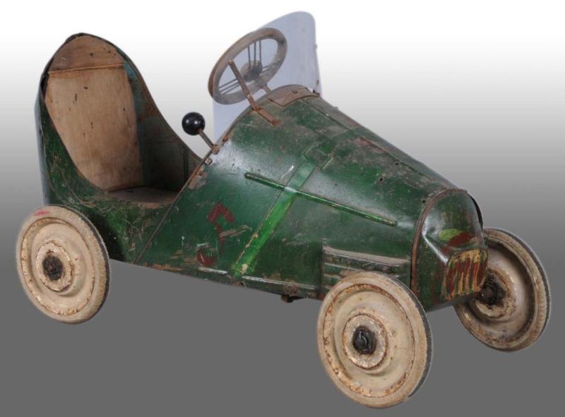 Appraisal: Pressed Steel Rusty Green Pedal Car Description s Chevron marker