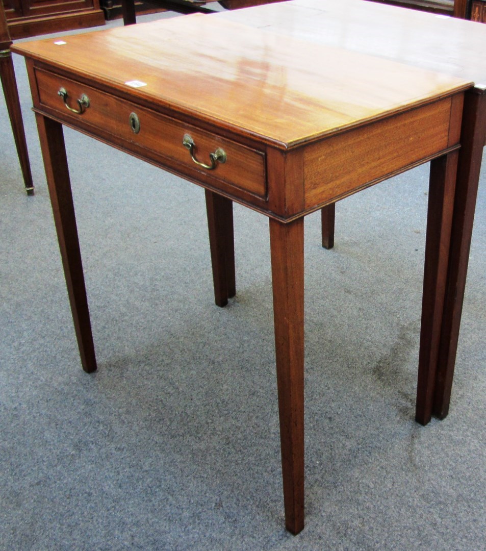 Appraisal: A George III mahogany single drawer side table on tapering