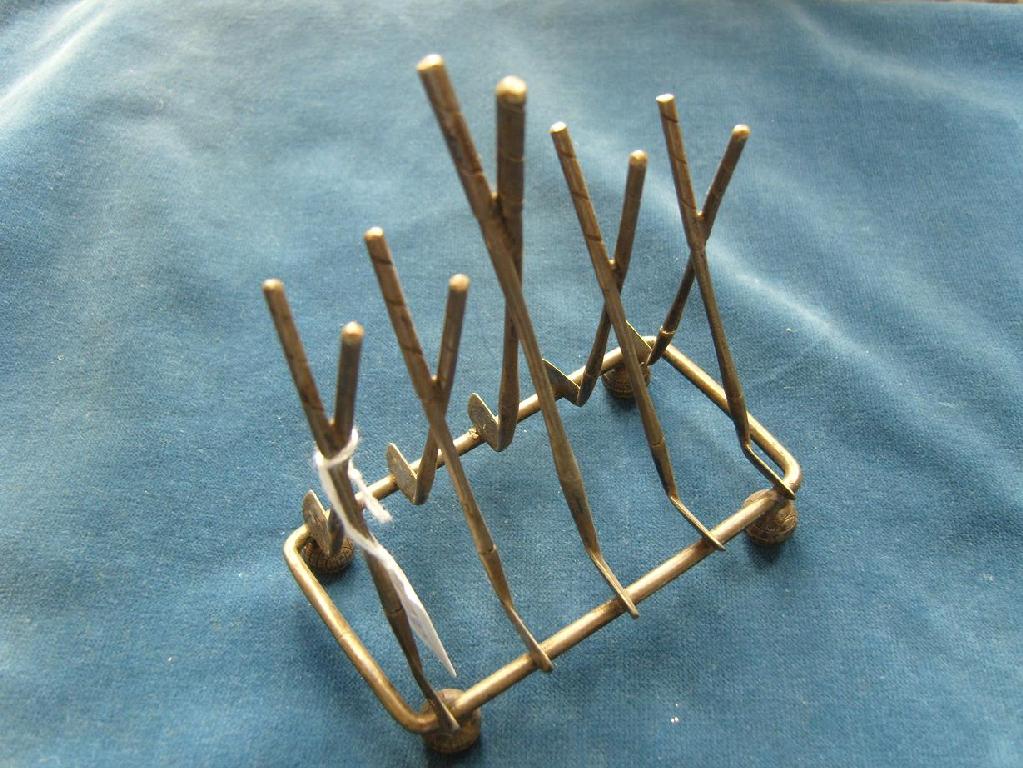 Appraisal: A silver plated -divisional toast rack in the form of