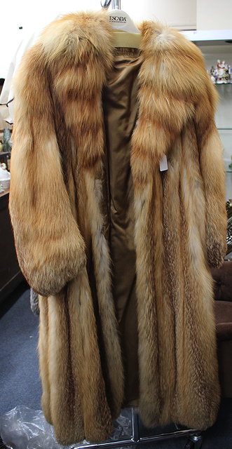 Appraisal: A NORWOOD FURS LONDON FOX FUR LONG COAT together with