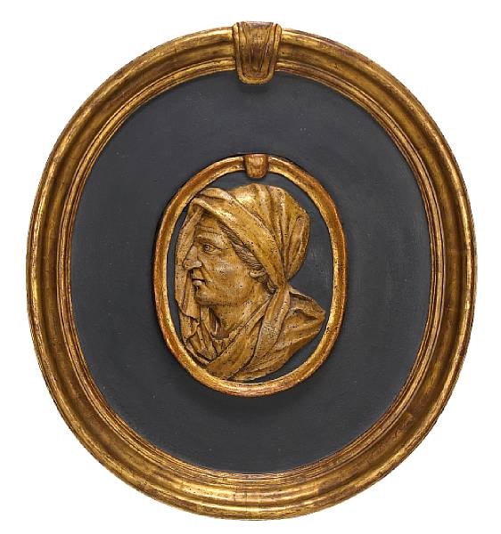 Appraisal: A pair of Flemish Baroque carved giltwood relief portraits within