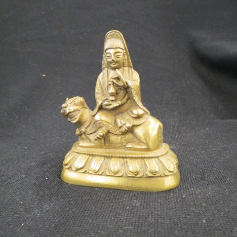 Appraisal: Chinese Brass Figurine of a goddess riding upon a foo