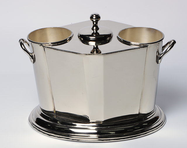 Appraisal: A NICKEL PLATED TWO BOTTLE WINE COOLER with faceted body