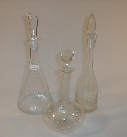 Appraisal: A slice cut decanter with facet cut stopper and two