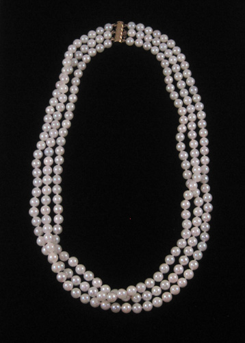 Appraisal: PRINCESS LENGTH TRIPLE STRAND PEARL NECKLACE having white strung pearls