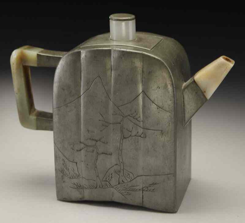 Appraisal: Chinese Qing jade and tin mounted zisha teapot one side