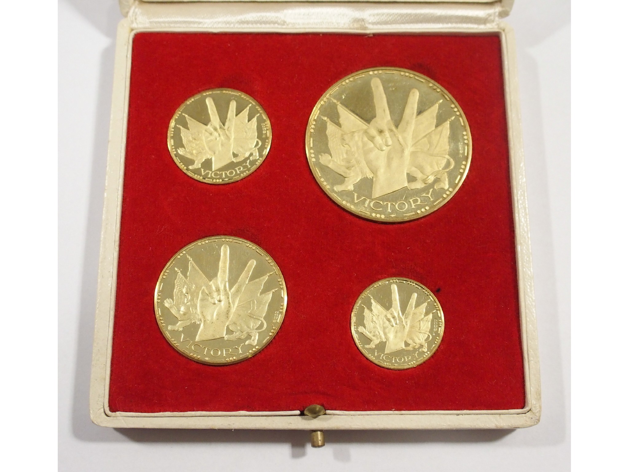 Appraisal: Four Winston Churchill ct gold commemorative medallionsMetal Import Limited in