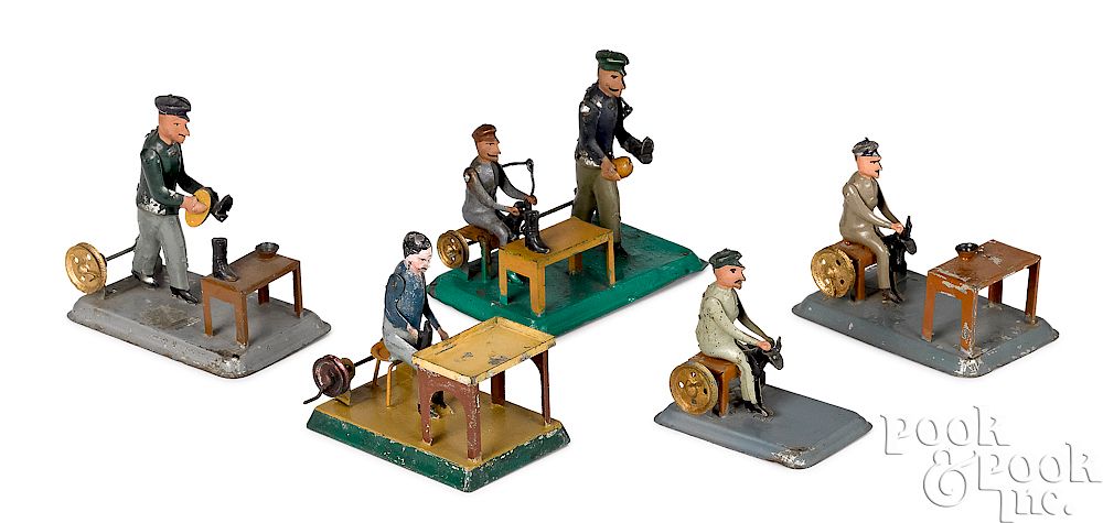 Appraisal: Five painted tin shoemakers steam toy accessories Five painted tin