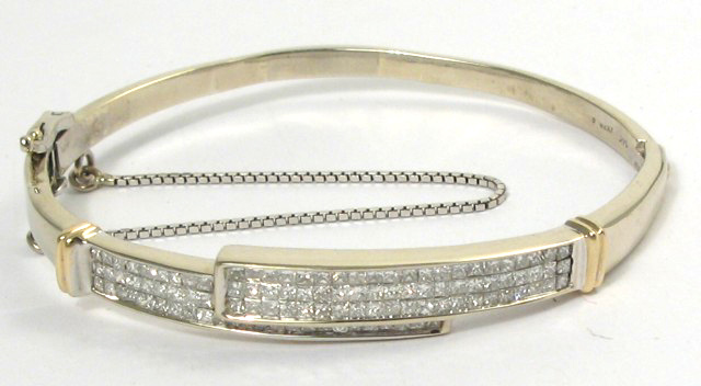 Appraisal: DIAMOND AND FOURTEEN KARAT WHITE AND YELLOW GOLD BANGLE pave'