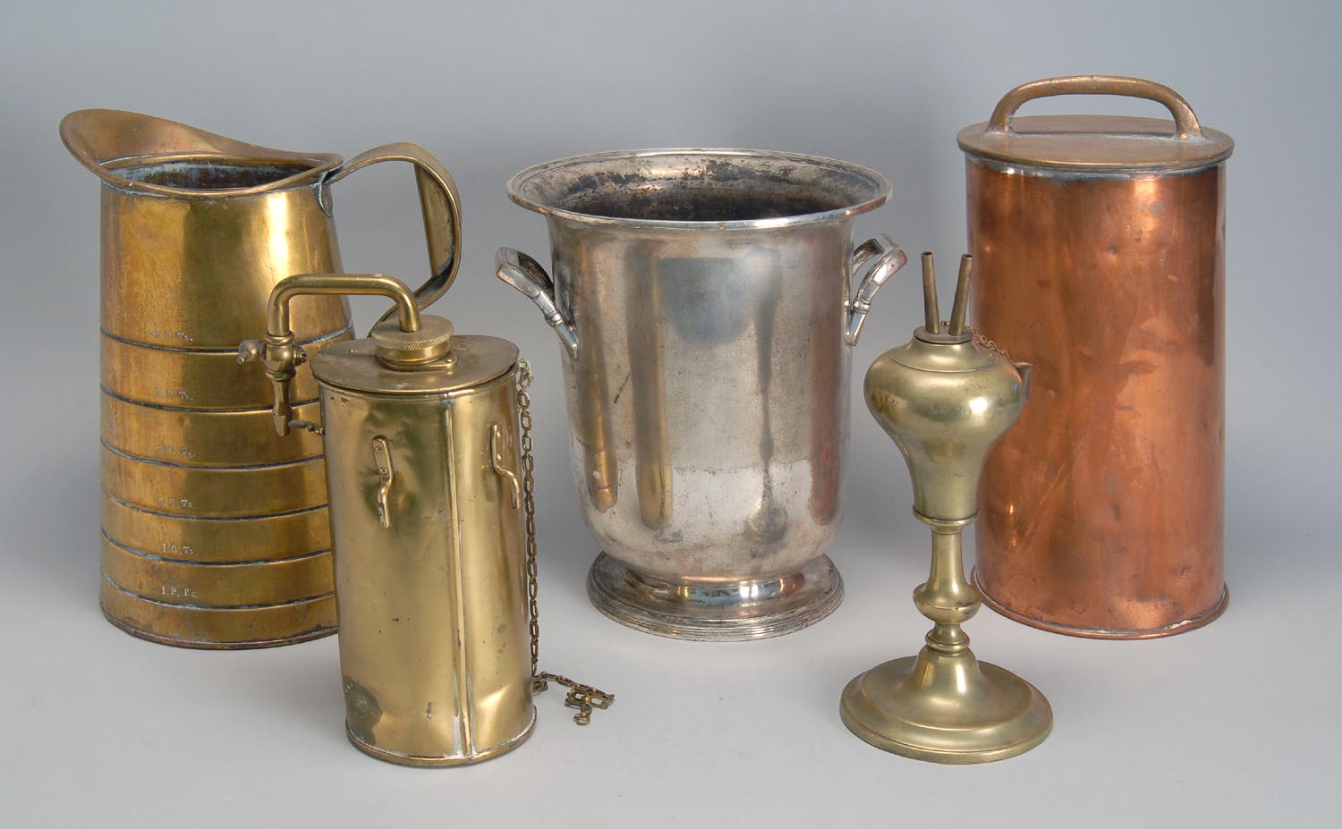 Appraisal: FIVE METAL ITEMS A silver plated silver champagne bucket by