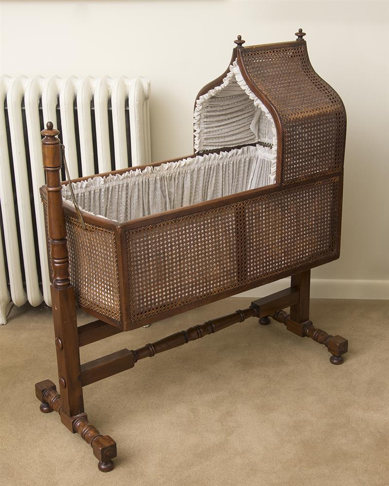 Appraisal: LATE REGENCY MAHOGANY AND CANED CHILD'S CRADLE With stand stand