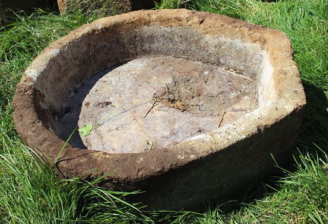 Appraisal: AN OLD SANDSTONE HORSESHOE SHAPED TROUGH with drainage hole cm