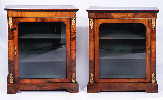 Appraisal: A PAIR OF VICTORIAN WALNUT SIDE CABINETS the interior fitted