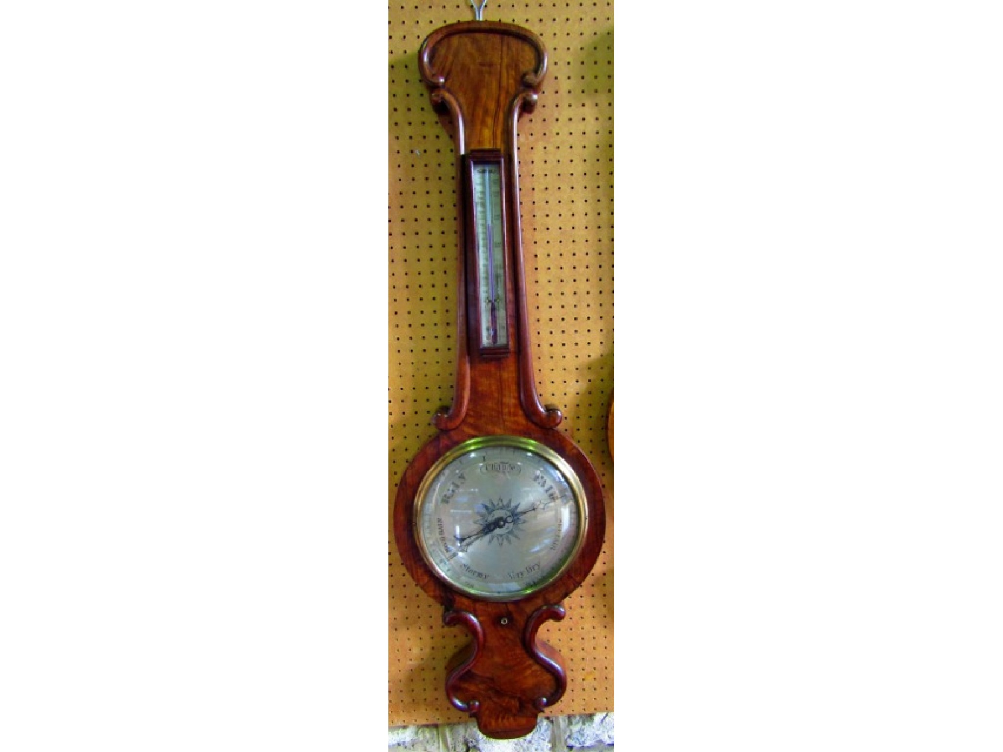 Appraisal: A substantial mid Victorian wheel barometer with figured mahogany case