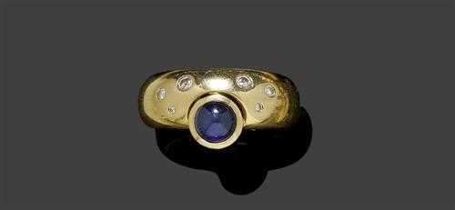 Appraisal: SAPPHIRE BRILLIANT-CUT DIAMOND AND GOLD RING Yellow gold Casual-elegant band