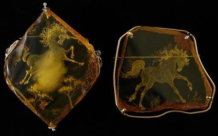 Appraisal: Two Carved Amber Brooches