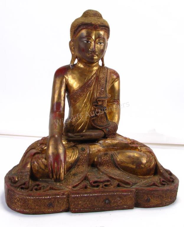 Appraisal: A carved solid wood Buddha figure green white red applied