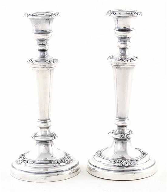 Appraisal: Pair Regency style silverplate weighted candlesticks floral design unidentified tree