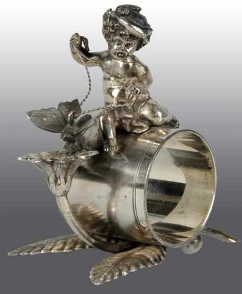 Appraisal: Cherub with Reins to Butterfly Napkin Ring Condition Excellent Size