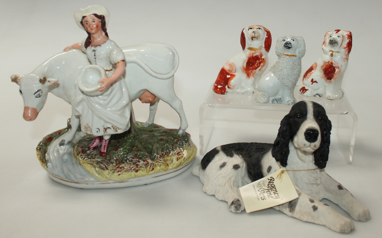 Appraisal: A late thC Staffordshire cow and milk maid group polychrome