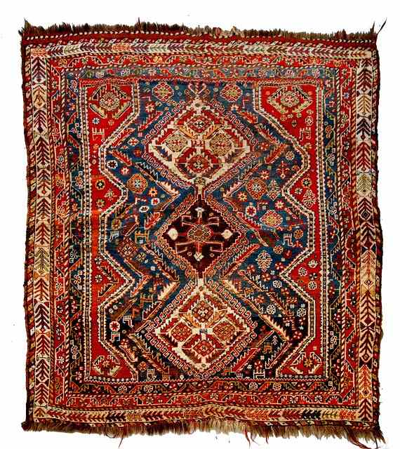 Appraisal: A KASHGAI RED GROUND RUG with central interconnecting medallions in