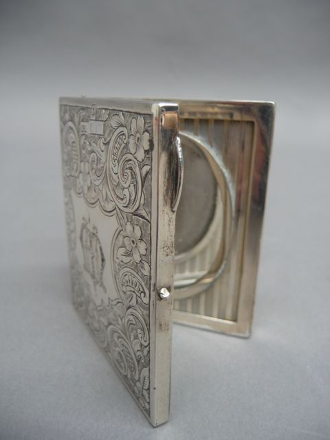 Appraisal: A Victorian sterling silver portable photo case Birmingham maker H