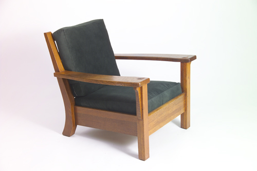 Appraisal: LIMBERT Oversized armchair with fixed shaped back broad open arms