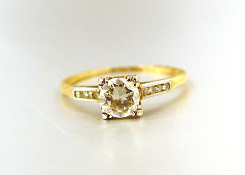 Appraisal: DIAMOND ENGAGEMENT RING K yellow gold ring contains one round