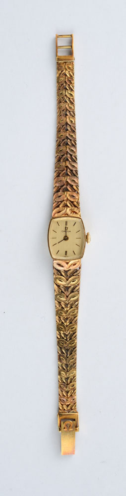 Appraisal: LADY'S K GOLD WRISTWATCH OMEGA An oval dial signed Omega