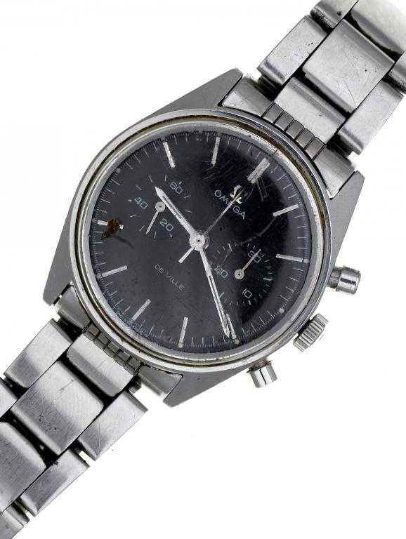 Appraisal: AN OMEGA STAINLESS STEEL DE VILLE CHRONOGRAPH WRISTWATCH with black