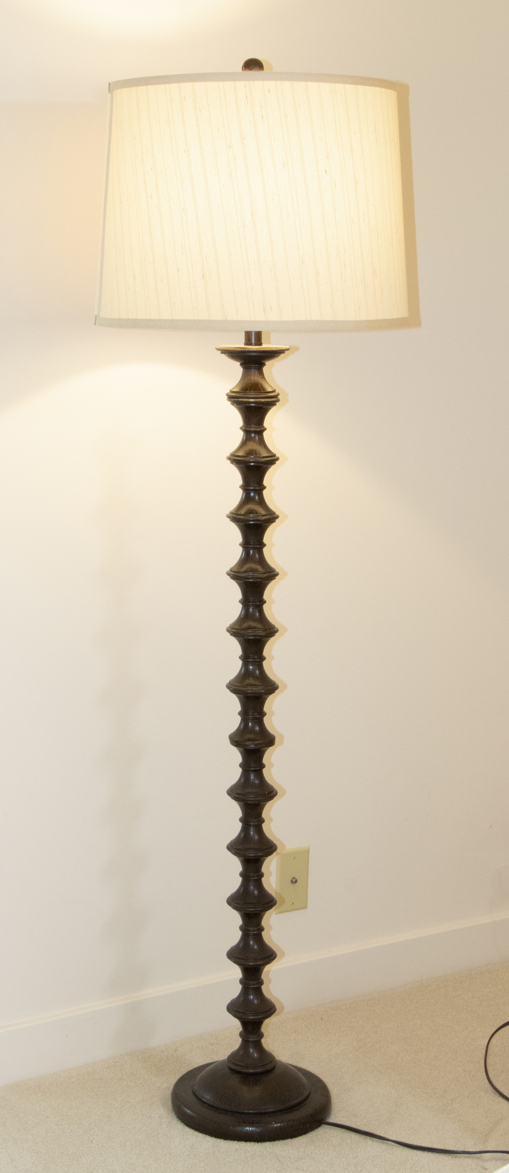 Appraisal: CARVED WOODEN FLOOR LAMP Dark-stained wooden carved floor lamp with