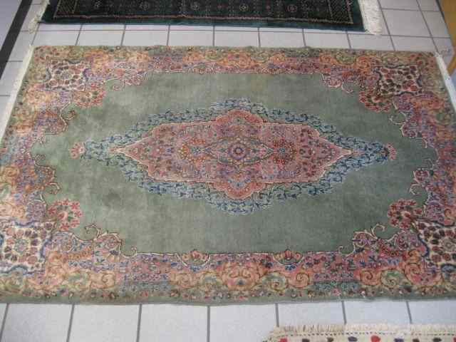 Appraisal: Kerman Persian Handmade Rug soft pastels fine floral green field