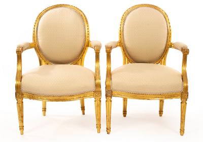 Appraisal: A pair of Louis XIV style armchairs with carved and