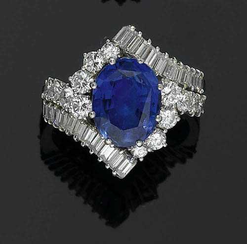 Appraisal: SAPPHIRE AND DIAMOND RING BUCHERER ca Platinum Elegant crois ring