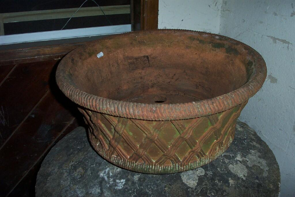 Appraisal: A pair of terracotta garden planters of circular form with