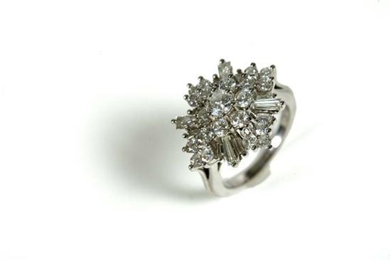 Appraisal: DIAMOND RING Platinum ring with tiers of round and baguette