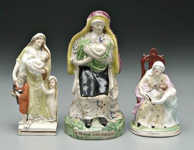 Appraisal: Three Staffordshire figures standing woman two children at her feet