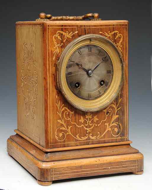 Appraisal: A TH CENTURY FRENCH ROSEWOOD 'CAMPAIGN' CLOCK the engine turned