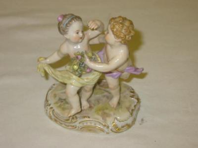 Appraisal: A MEISSEN PORCELAIN FIGURAL GROUP of two putto one holding