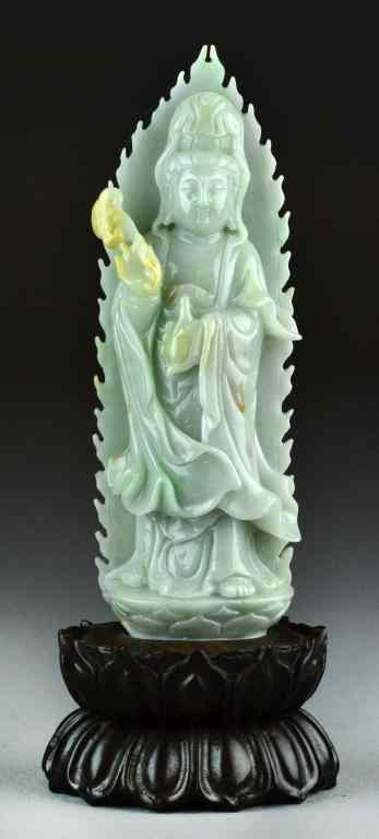 Appraisal: Chinese Carved Celedon Jade Kwan YinDepicting Kwan Yin holding a