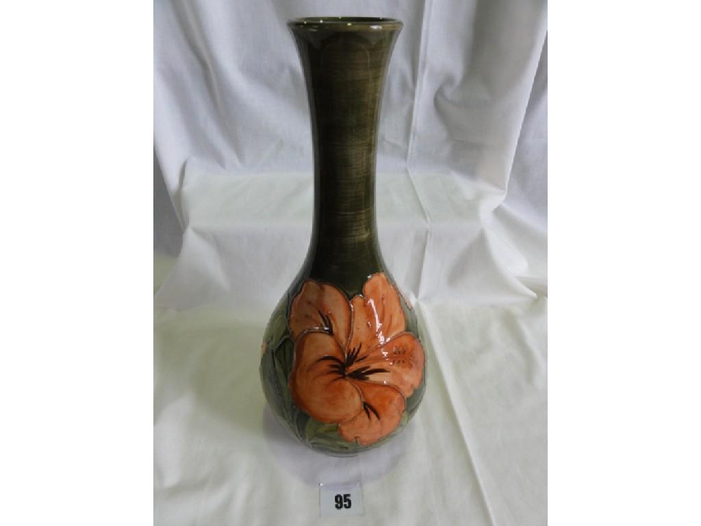 Appraisal: A Moorcroft Pottery tall green ground vase with drawn neck